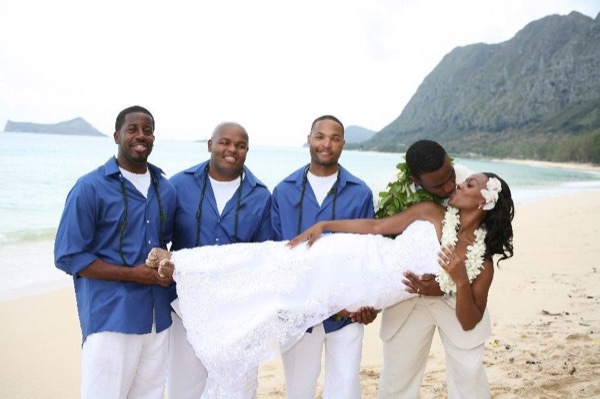 Damarus with his groomsmen in royal blue, in the sunshine