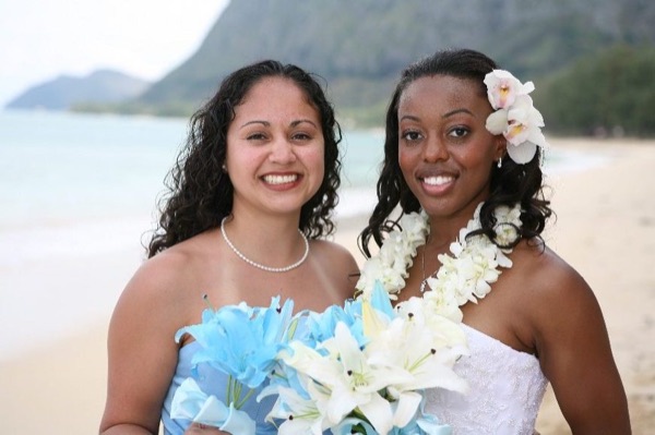 The bridal party in blue on the beach, from another angle