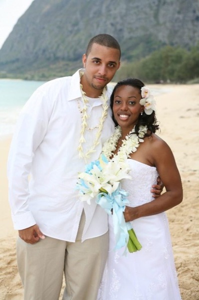 Damarus with his groomsmen in royal blue, smiling