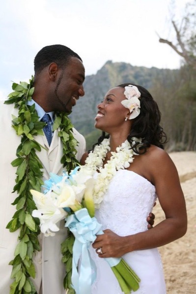 Naheshae and Damarus on the beach with the mountains behind them, close up