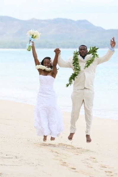 Naheshae and Damarus on the beach with the mountains behind them, side by side