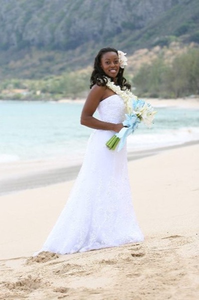 Naheshae and Damarus on the beach with the mountains behind them, in the afternoon light