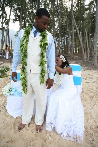 A kiss on the beach, having fun