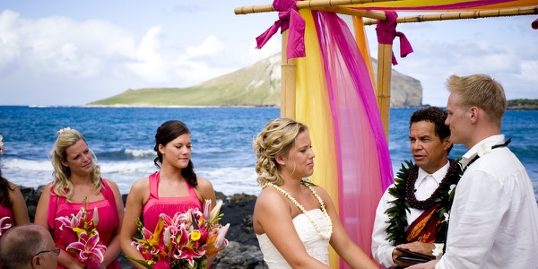 Family watching the ceremony by the lava rocks, another moment