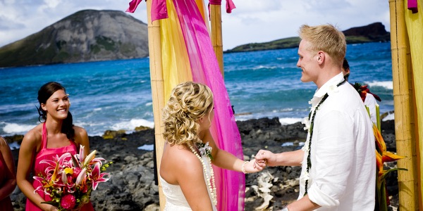 Natasha and Tyson under the magenta and mango arch, another photo