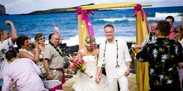 Family watching the ceremony by the lava rocks, another photo