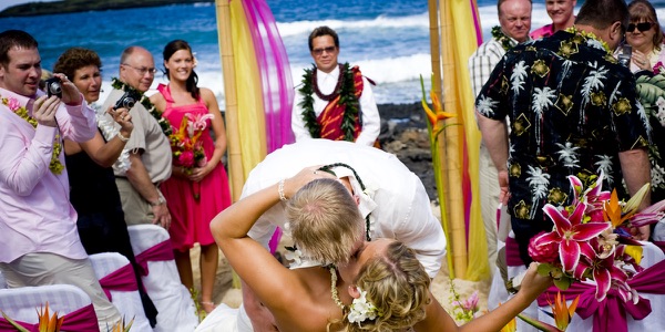 Natasha and Tyson under the magenta and mango arch, photo 2