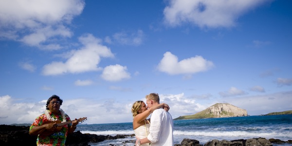 Natasha and Tyson with their bridal party on the rocks, another moment