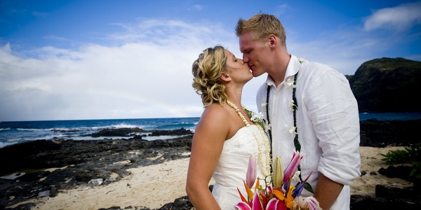 Natasha and Tyson with their bridal party on the rocks, another photo