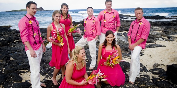 Natasha and Tyson with their bridal party on the rocks, a moment later