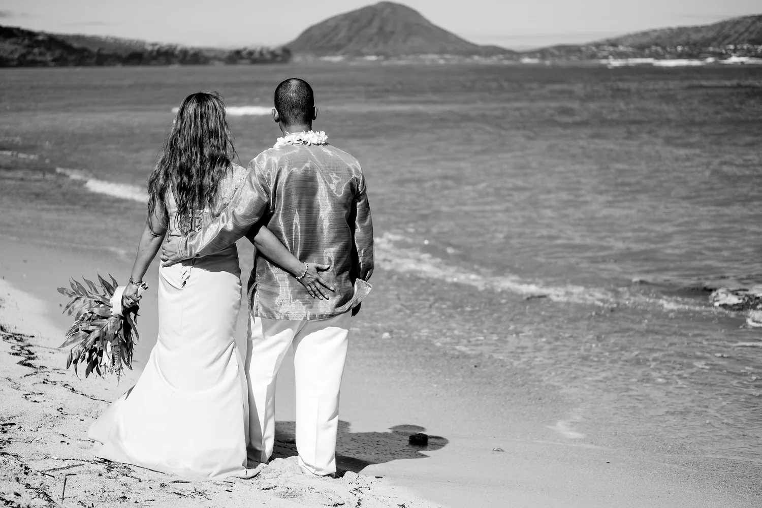 A black and white photo by the water