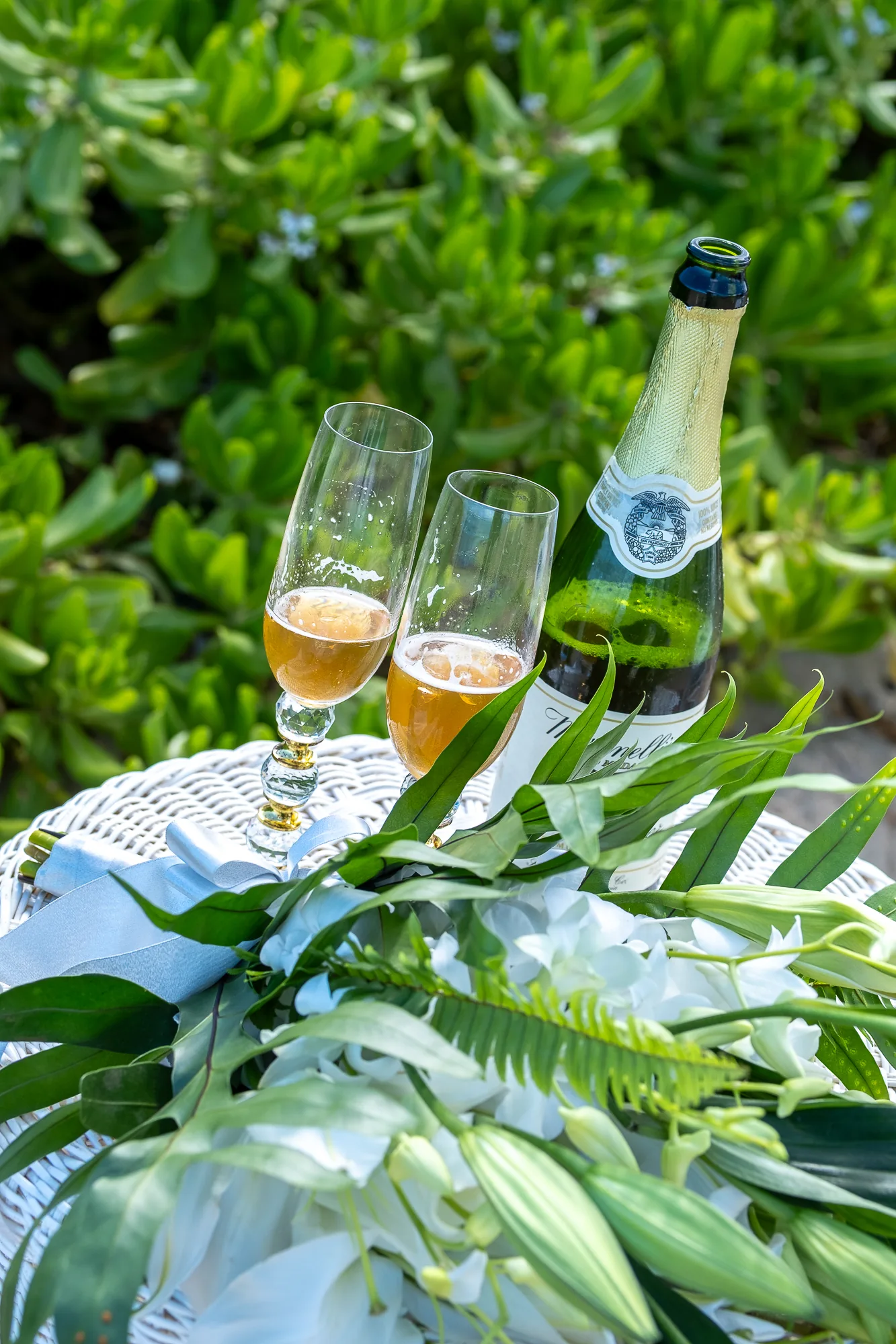 Champagne with tropical leaves
