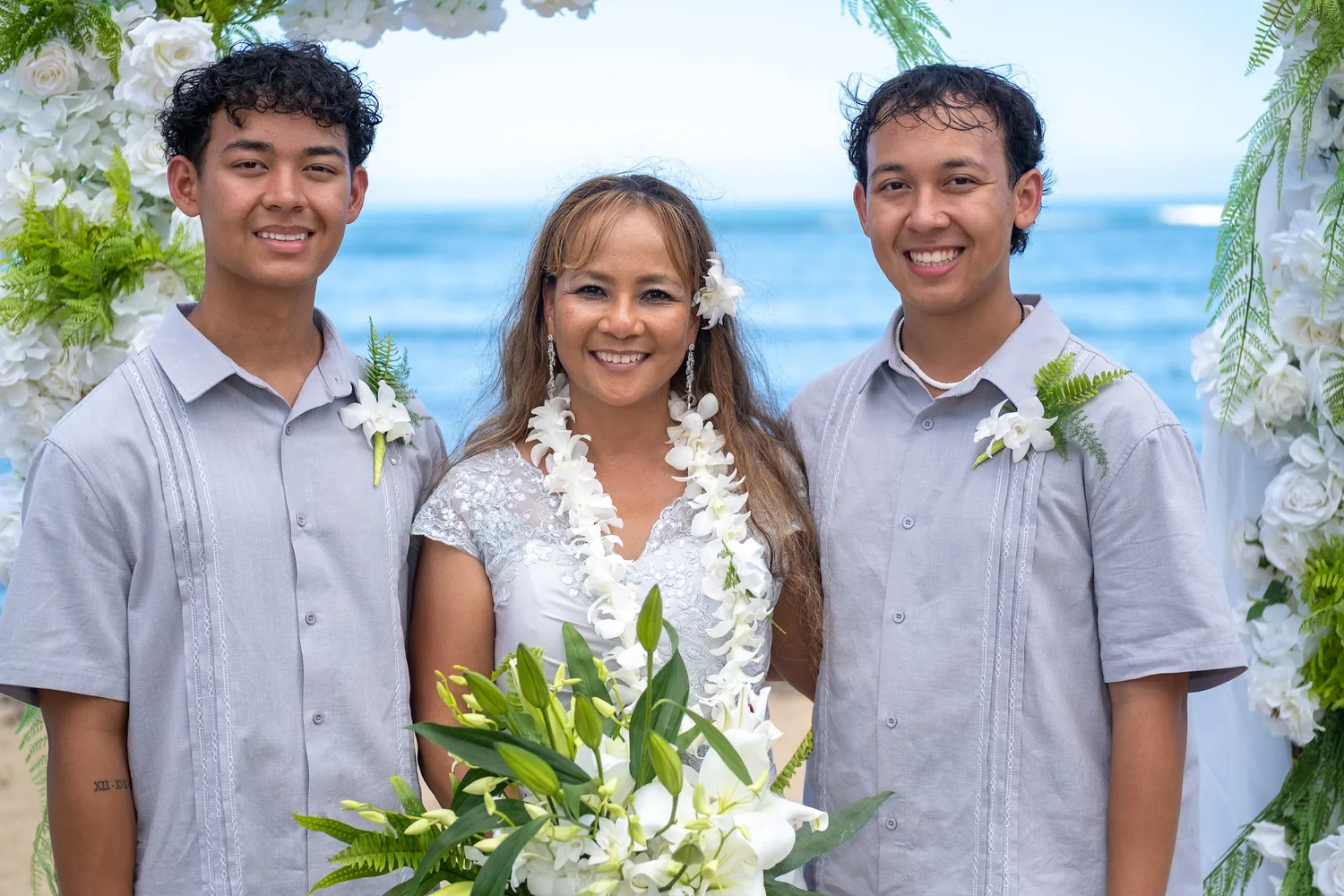 Rose and Nate with their sons after the vows