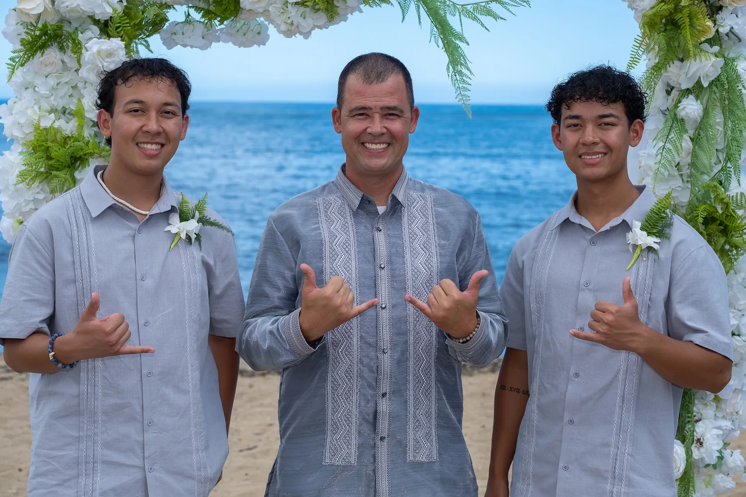 Nate and his sons smiling at the arch