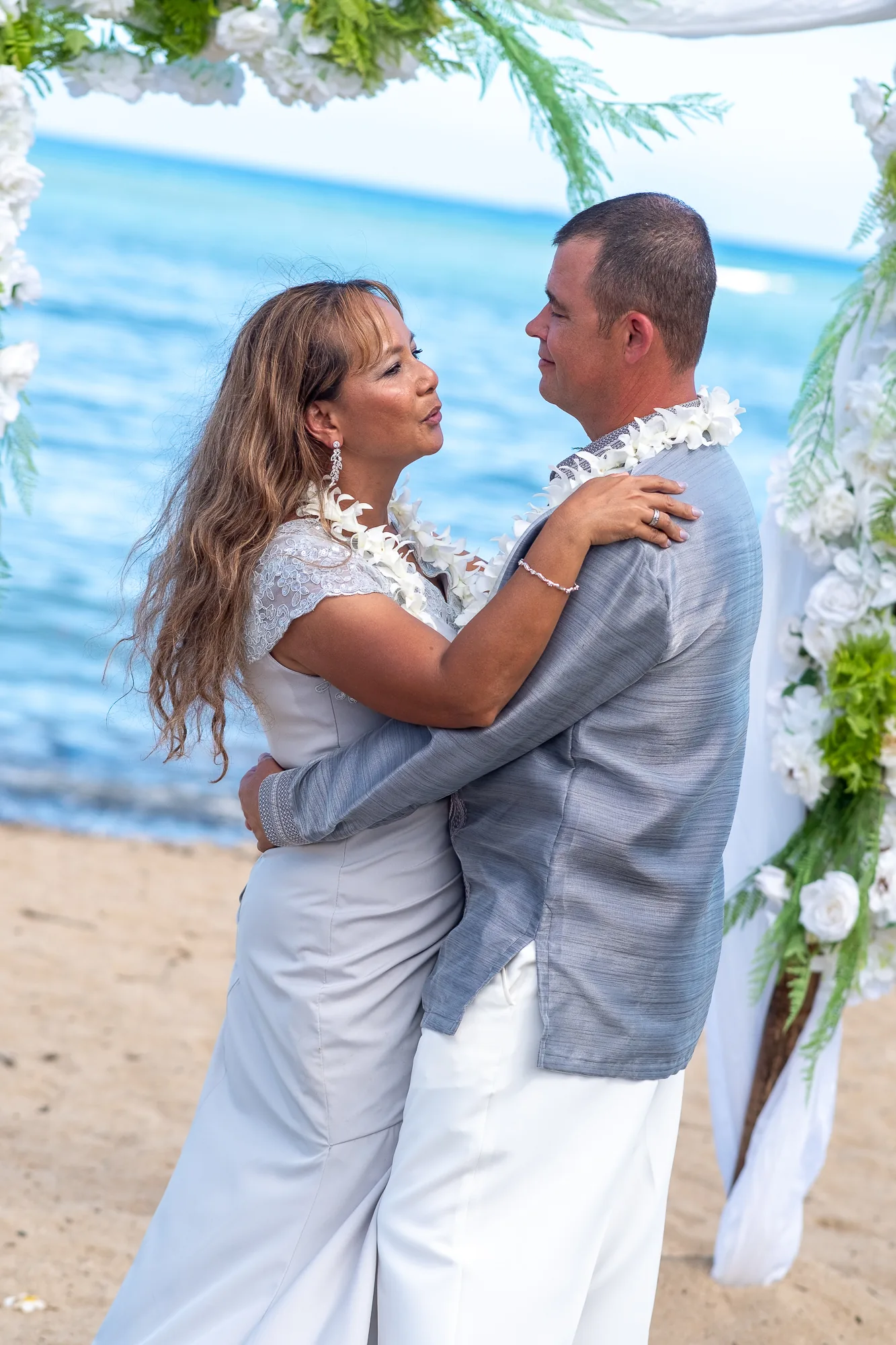 Their first dance under the bamboo arch
