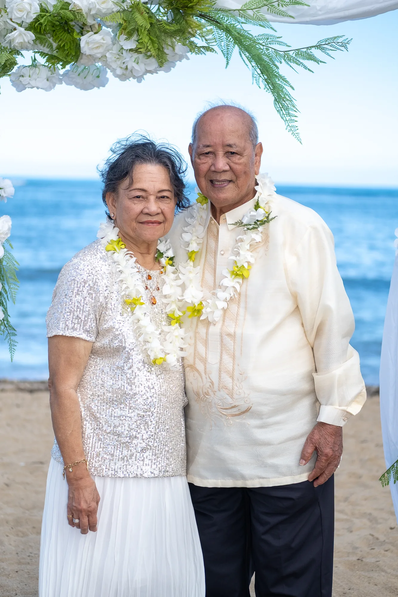 Their parents together at the arch