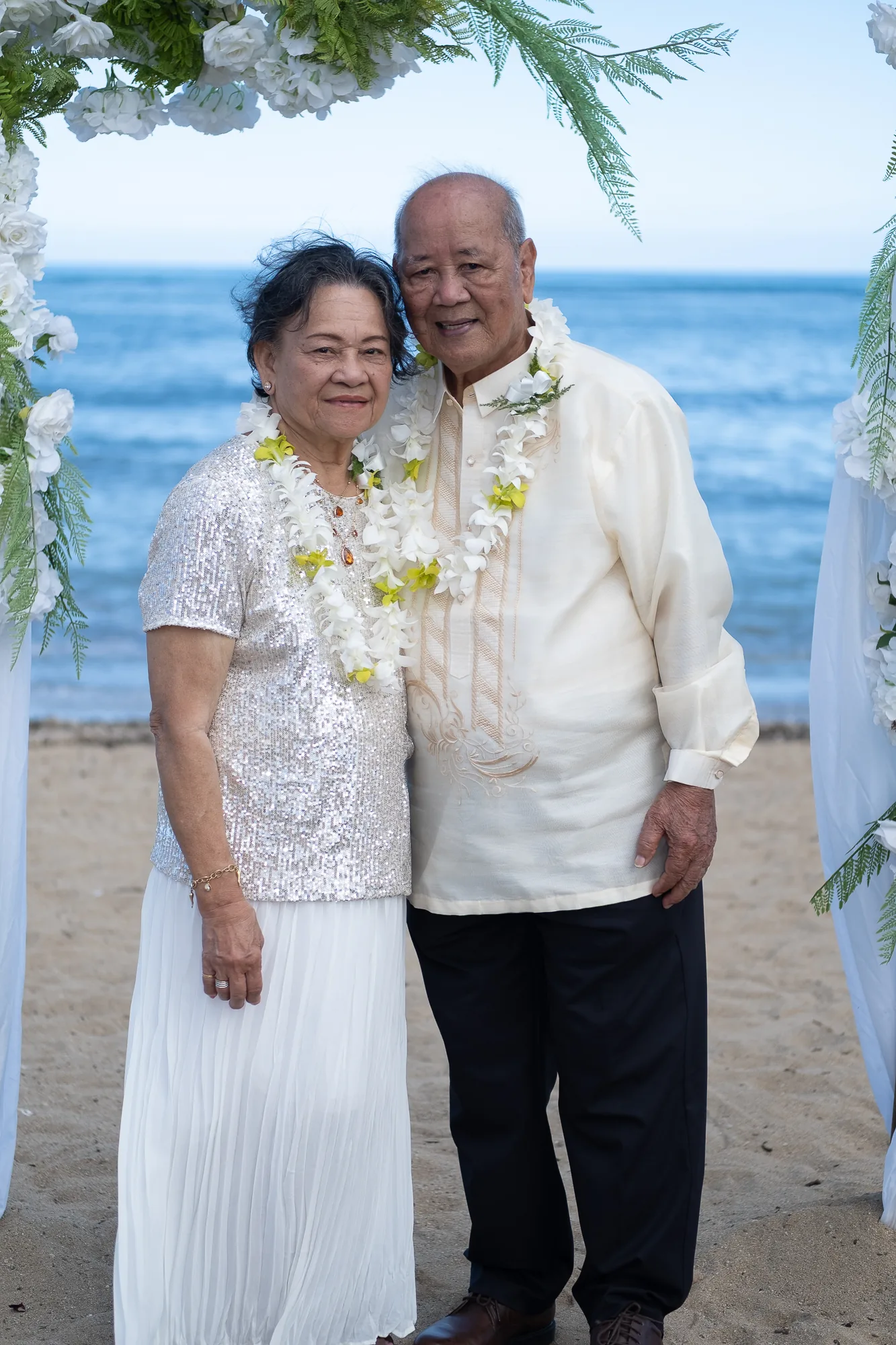 Their parents sharing a kiss on the beach