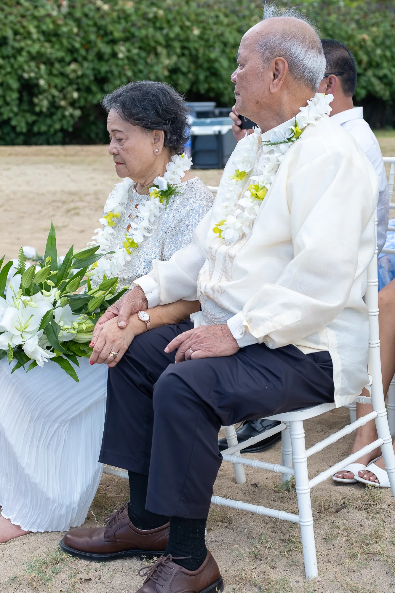 Their parents watching the ceremony