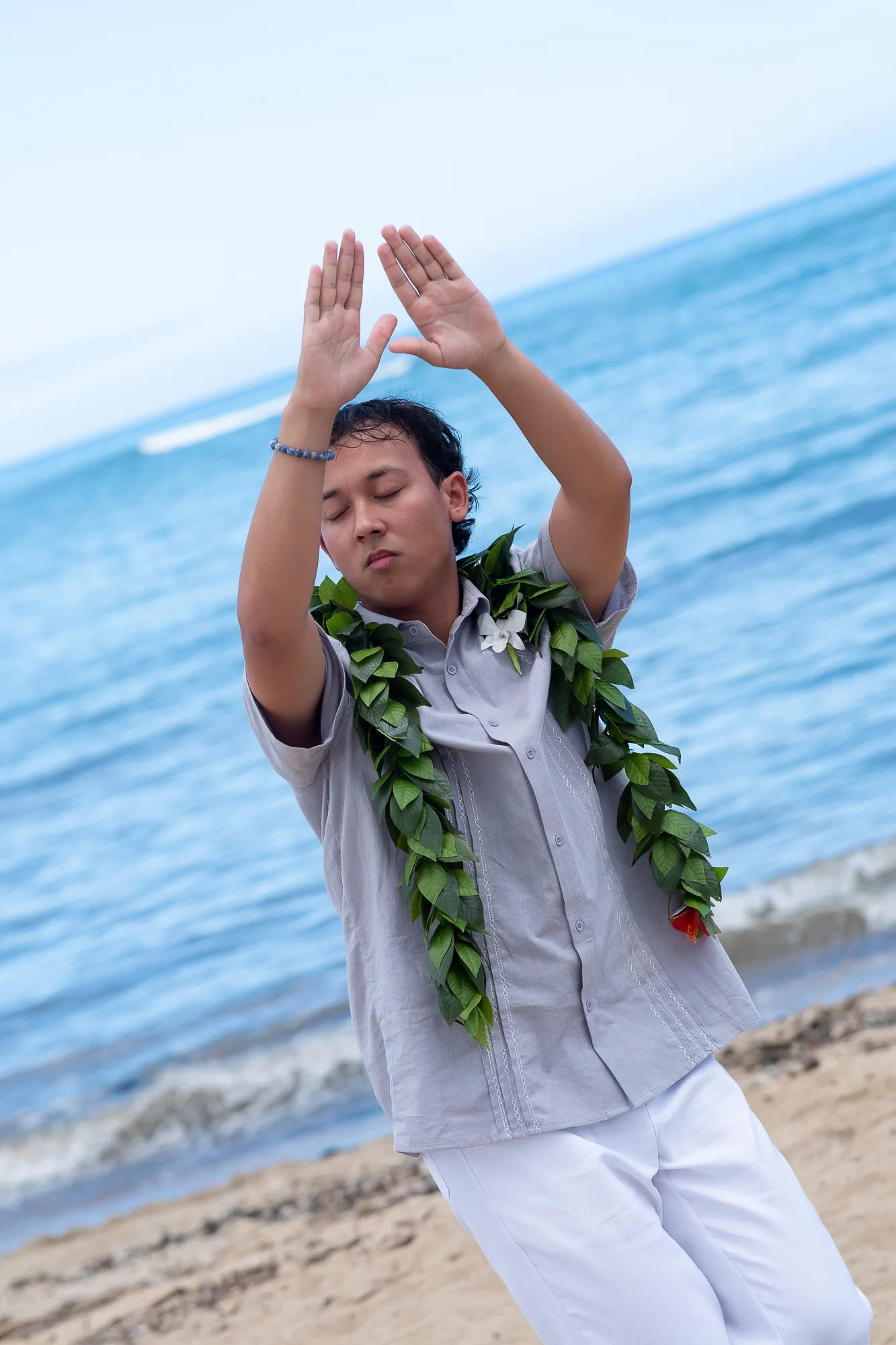 Hula hands telling the story of the song