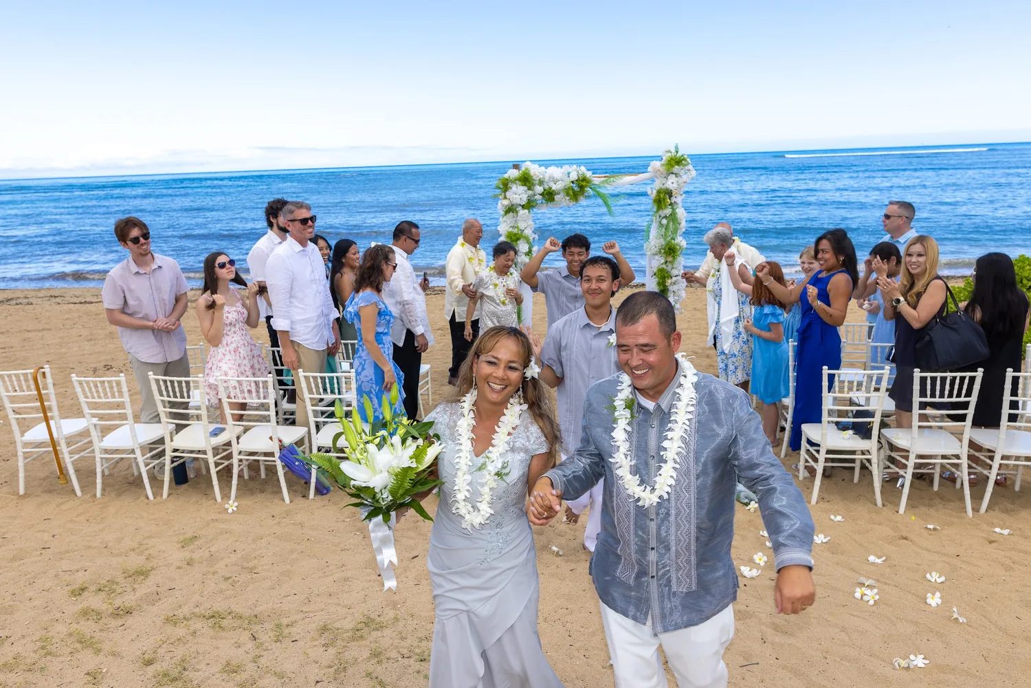 Vows renewed and celebrating on the beach