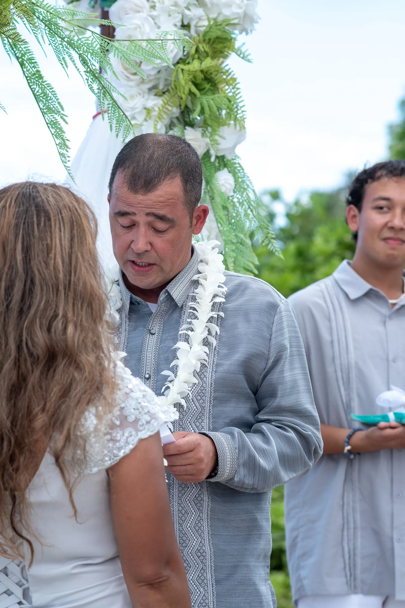 Nate reading his vows with his son beside him