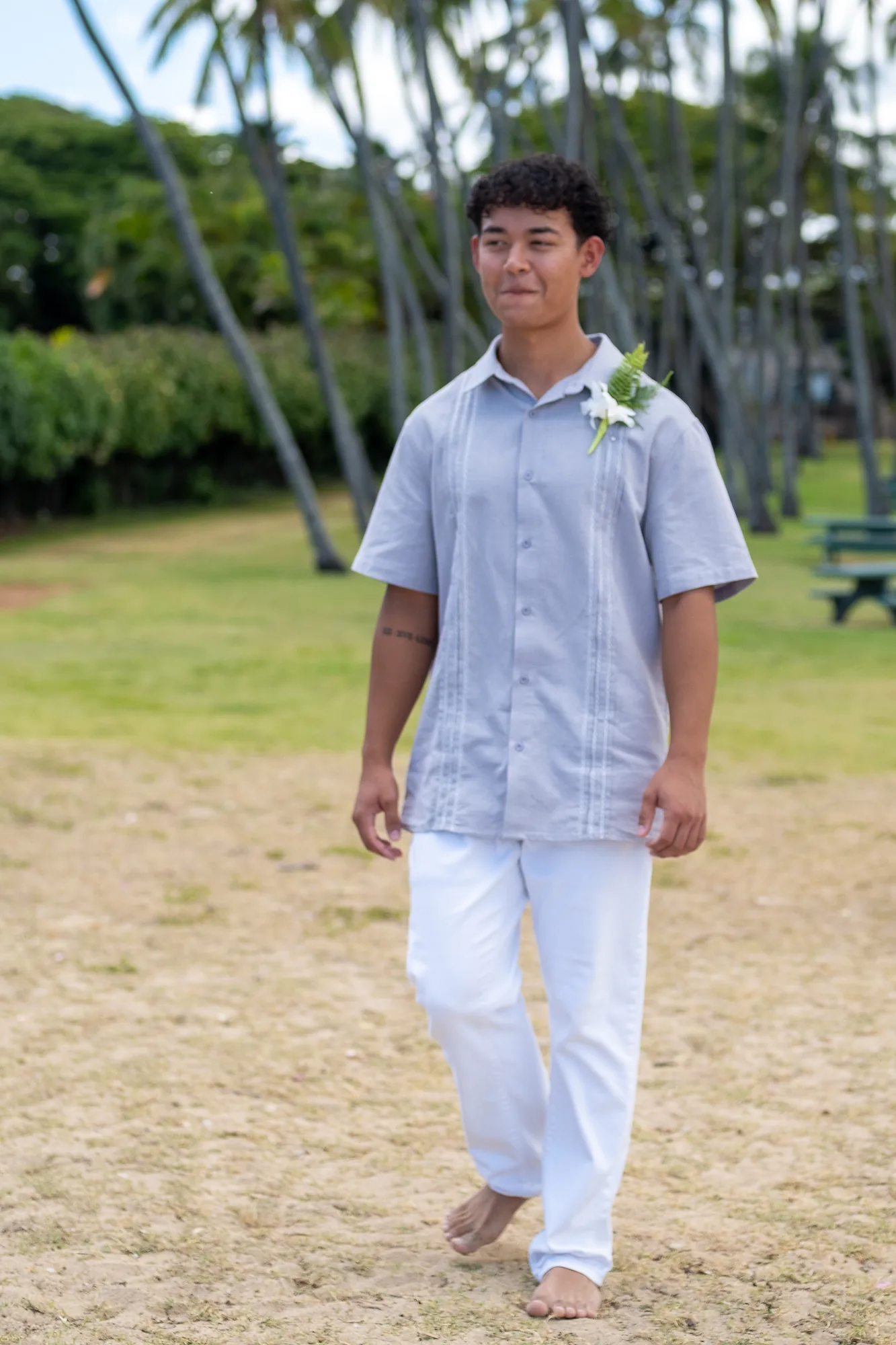 Their other son walking to the beach