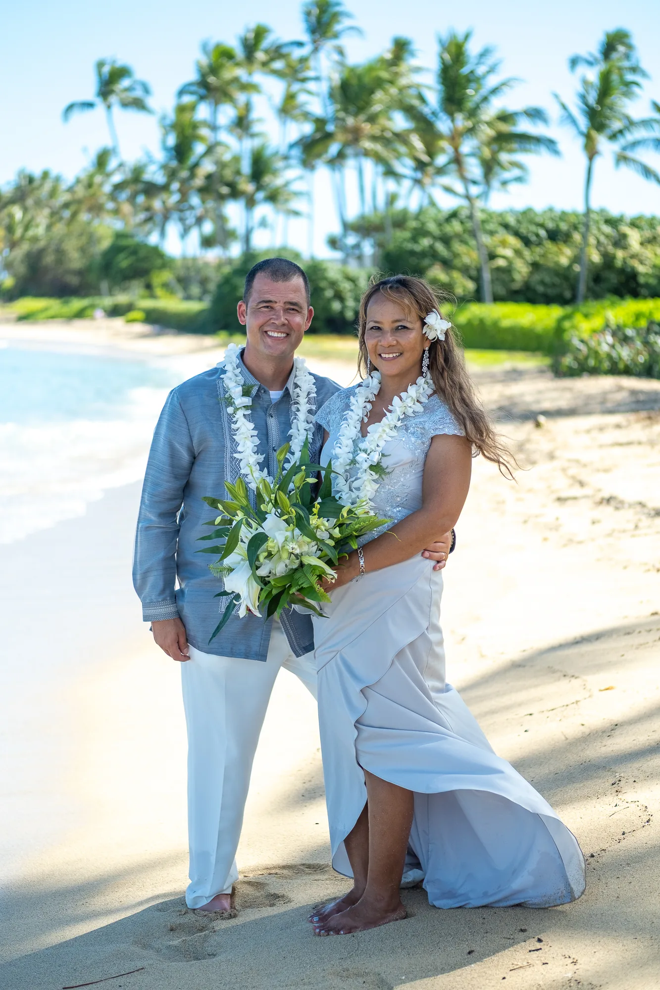 A portrait with the palm trees behind