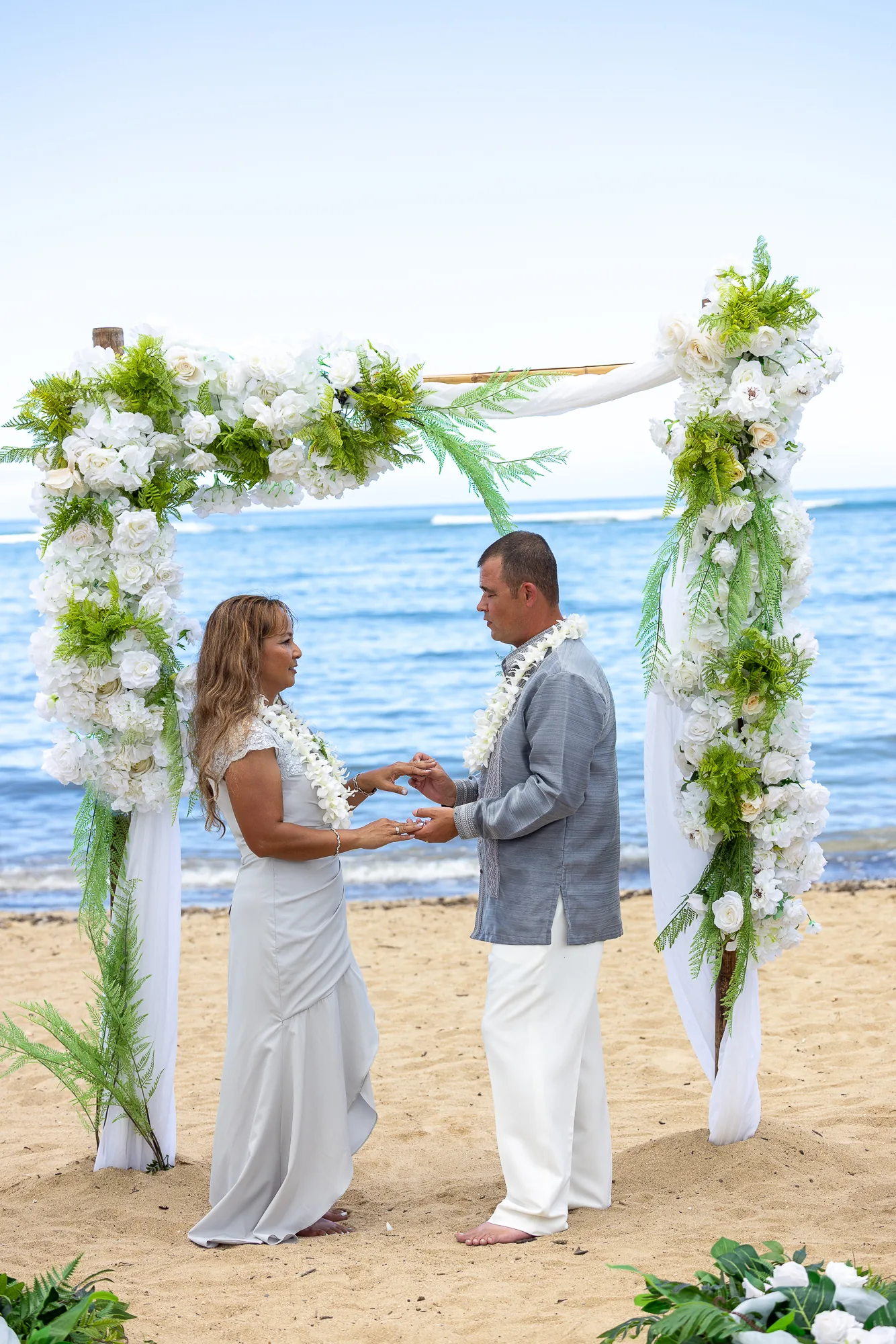 Renewing their vows by the ocean