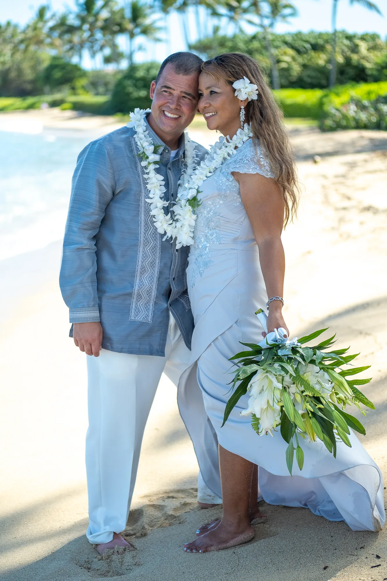 Rose and Nate with her bouquet on the beach