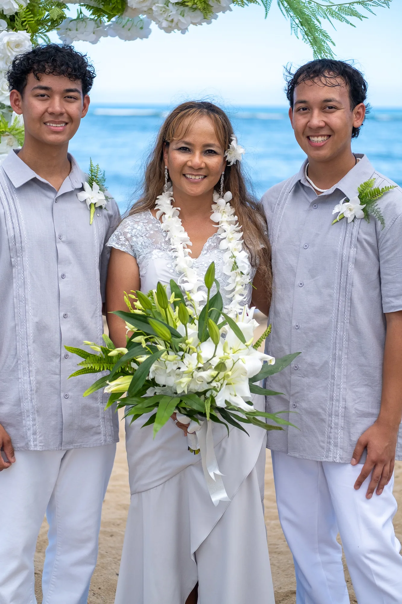 Rose between her sons with her bouquet