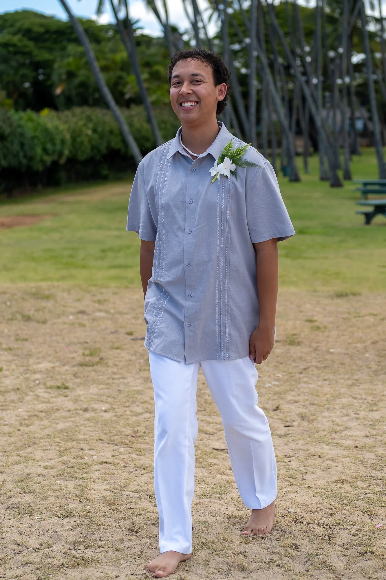 Their son walking across the park to the beach