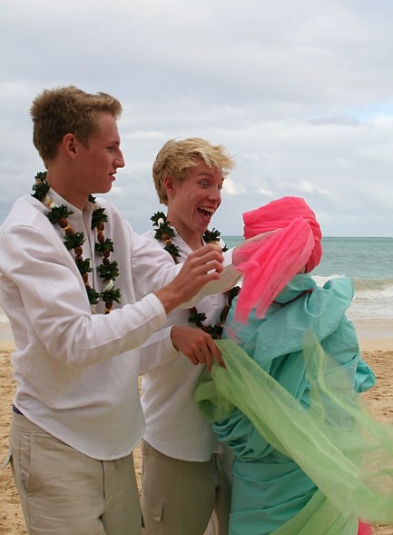 Teri and Dennis with their children on the beach, from the aisle