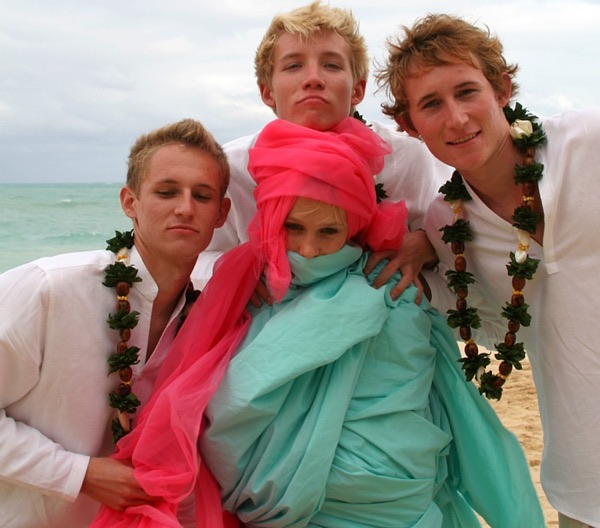 Teri and Dennis with their children on the beach, in the afternoon light