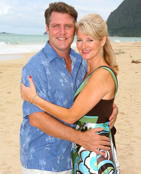 Friends and family with Teri and Dennis on the beach, laughing together