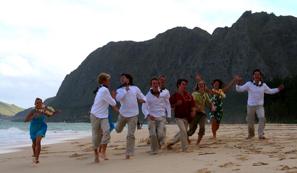 Teri and Dennis with their children on the beach, from the side