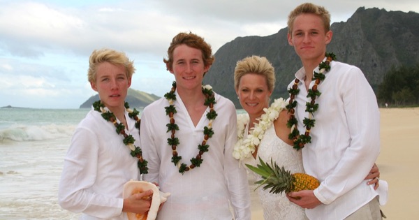Teri and Dennis with their children on the beach, up close