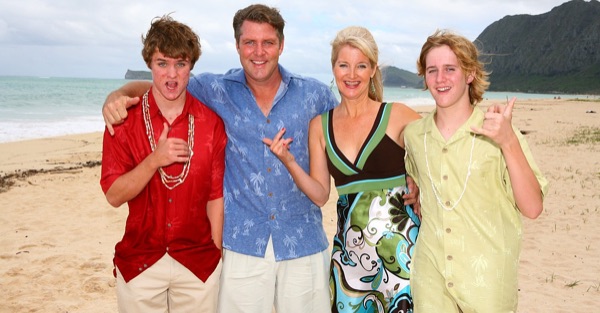 Friends and family with Teri and Dennis on the beach, smiling