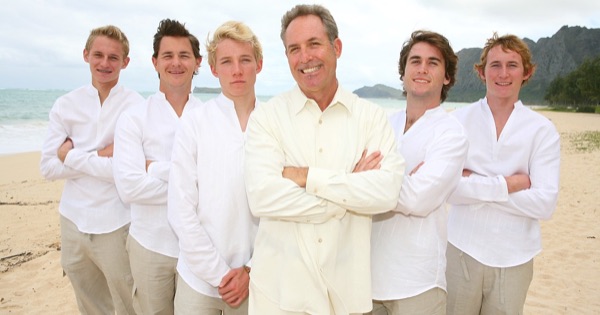 Teri and Dennis with their children on the beach, close up