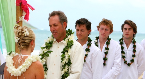 Teri and Dennis during their beach ceremony, under a blue sky