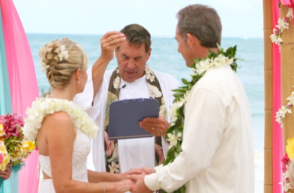 Teri and Dennis during their beach ceremony, in the sunshine