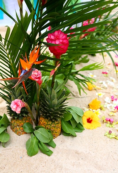 Pineapples with bird of paradise flowers