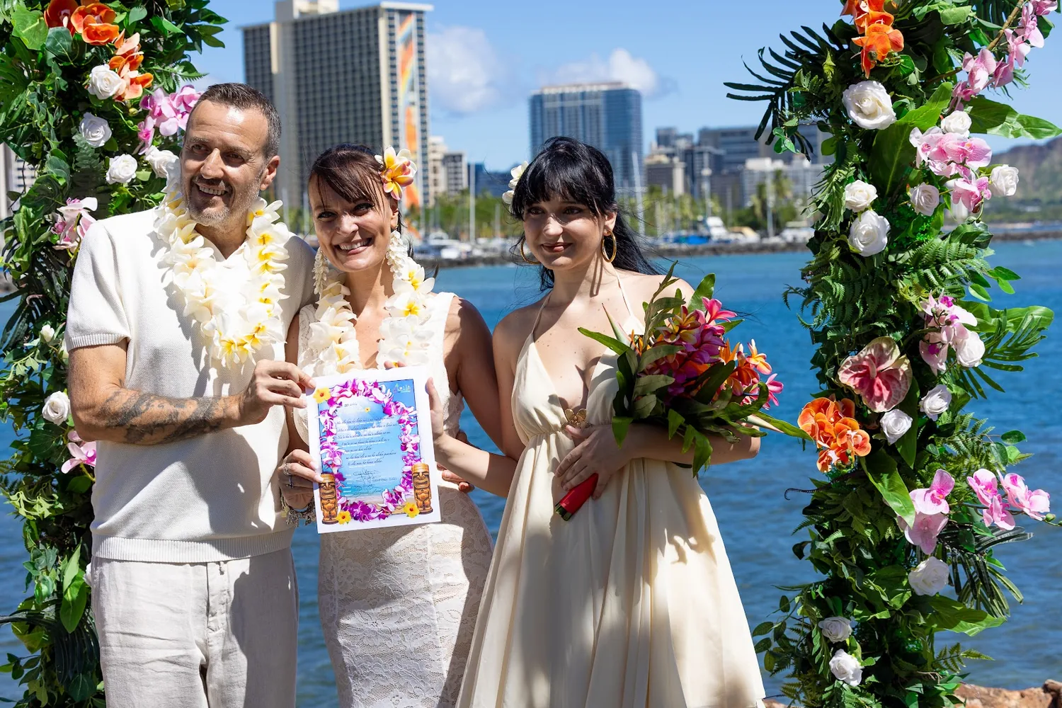 Holding their vow renewal certificate