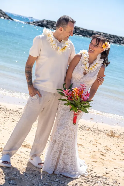 Portrait on the beach with her bouquet