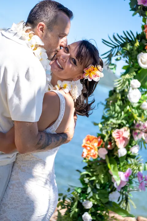 Detail of her lei and the flower arch