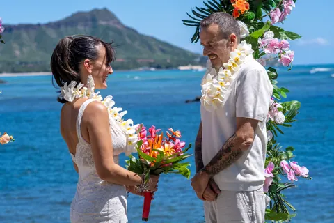 In their leis at the arch