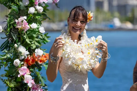 Sara smiling in her white plumeria lei