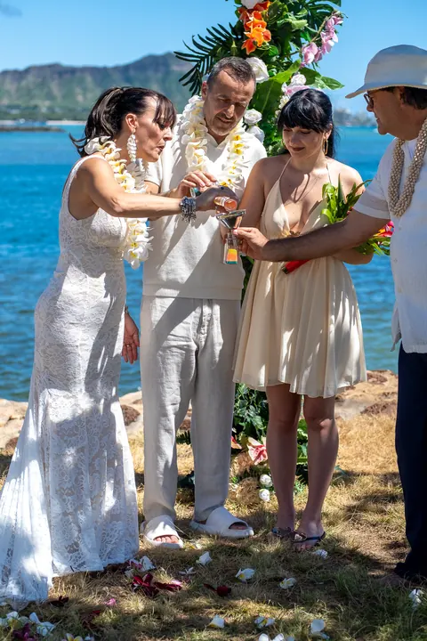 Sara with two young women in white dresses