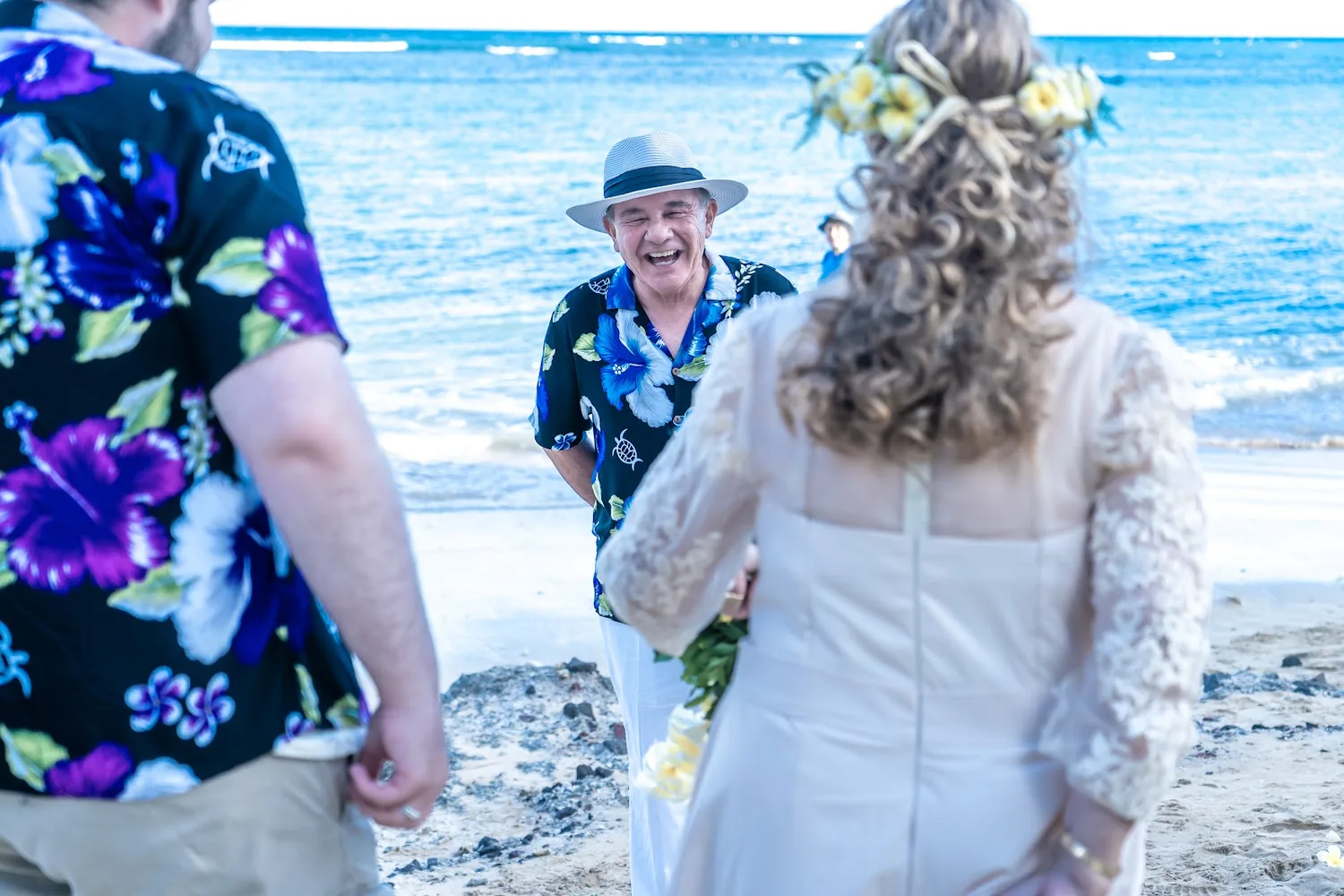 Shirley in her yellow plumeria haku arriving on the sand