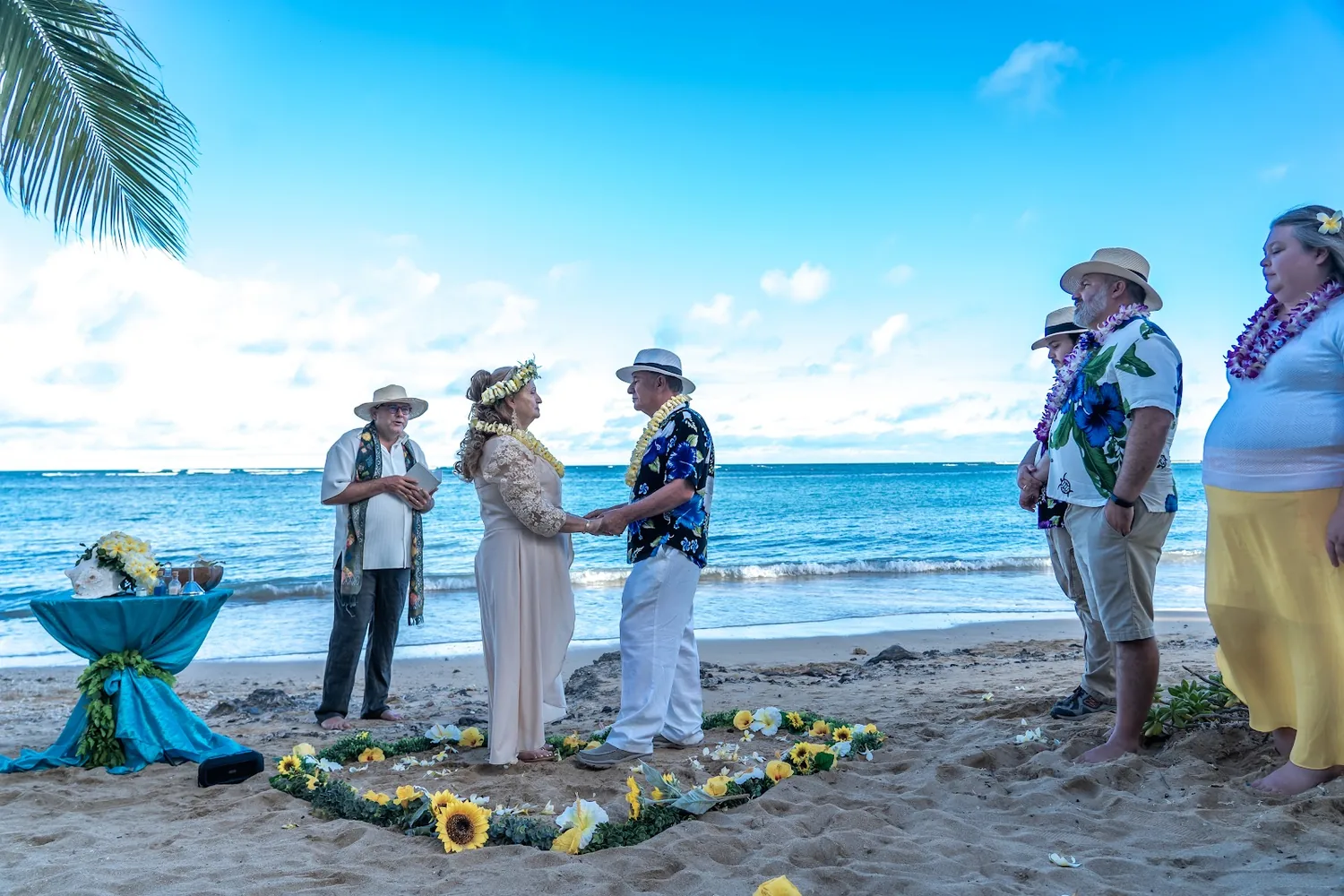 The ceremony on the beach by the flower heart