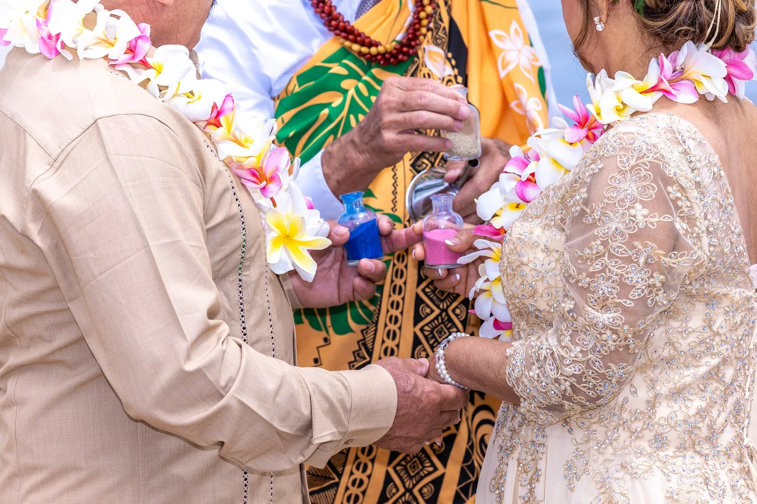 Exchanging flower leis under the arch